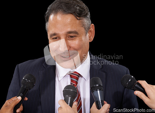 Image of Microphone, business and man with press conference, smile and information on a dark studio background. Government official, person or interview with questions, statement and speaking with news or mic