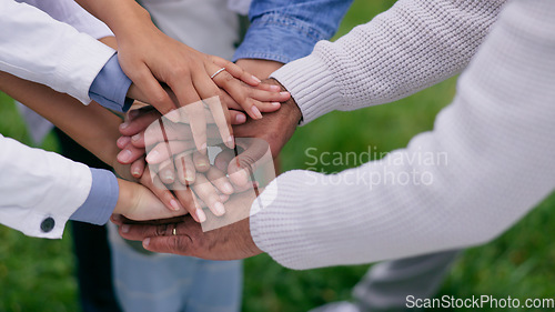 Image of People, hands stack and circle in park for support, teamwork or solidarity with goals in nature. Group, huddle and outdoor for family trust, link and connection with synergy with motivation on lawn