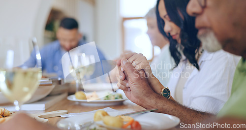 Image of Home, praying and family with food, lunch and festive celebration with blessing, brunch and thanksgiving. Holding hands, apartment and group of people with religion, ritual and gratitude with worship