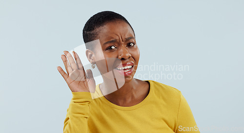 Image of Listening, confused and whisper with portrait of black woman in studiofor deaf, hearing and news. Communication, quiet and person asking for hand gesture, speaking and secret on blue background