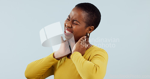 Image of Black woman, neck pain and injury in stress, pressure or anxiety against a gray studio background. Face of frustrated African female person or model with sore joint, inflammation or ache on mockup