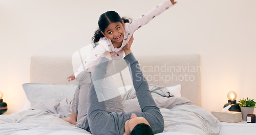 Image of Father, daughter and bed in home for plane game, bonding or love with care, support and balance. Dad, girl child and happy for playing airplane in bedroom for trust, relax or together in family house