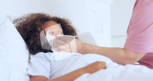 Image of Blowing nose, children or a boy sick in bed to relax or recover and a parent in the home to care or check. Family, kids and a child in the bedroom of an apartment with tissue for cold or flu