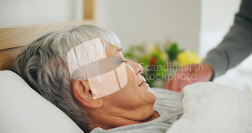 Image of Sleep, tired and a senior woman in bed for peaceful rest or to relax in her retirement home closeup. Face, morning and eyes closed with an exhausted old person dreaming in the bedroom of an apartment