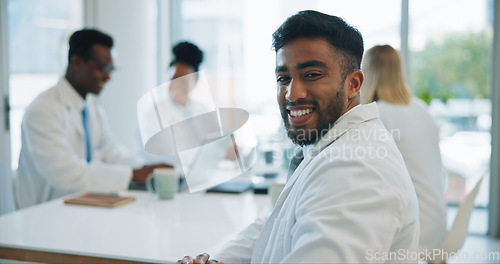 Image of Portrait, man and doctors in a meeting, smile and healthcare with planning, talking and teamwork. Face, professional and group with management staff, research and brainstorming with conversation