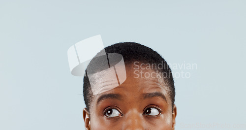 Image of Thinking, space and eyes with woman in studio for mockup, planning and opinion idea. Question, why and confused with closeup face of african person on grey background for guide, remember and choice