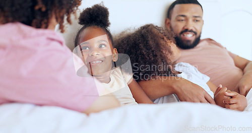 Image of Home, bed and family with parents, children and happiness with joy, bonding together and relax. Mother, father and kids in a bedroom, funny or laughter with peace, morning and weekend break with love