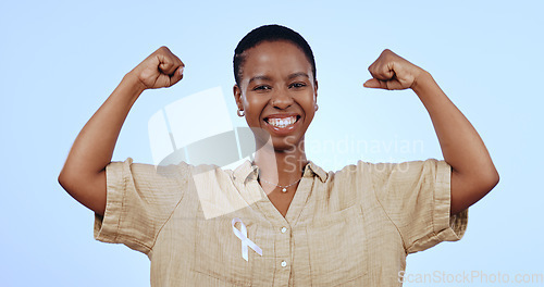 Image of Portrait, woman or arm flex with smile in studio for breast cancer winner, solidarity or muscle for feminism on mock up space. Black person, face or happy and flexing on blue background for awareness