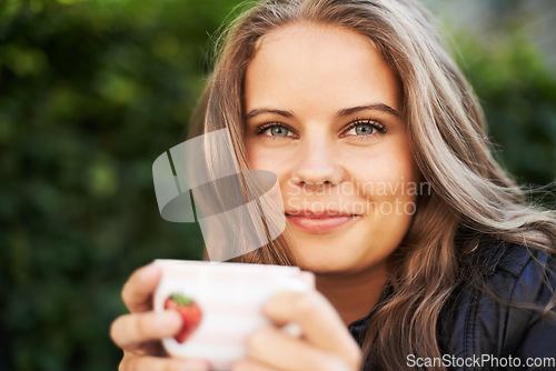 Image of Happy woman, portrait and coffee cup to drink, espresso or latte outdoor in backyard. Cafe, restaurant and smile with tea, mug and relax at brunch in summer with freedom, peace or calm morning