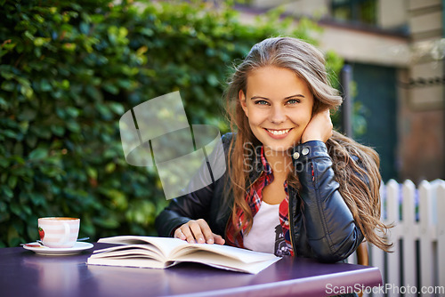 Image of Woman, smile and reading book at outdoor coffee shop, cafe or restaurant with espresso, latte or cup. Happy, girl and relax with green tea, drink or learning info in summer, morning or city bistro