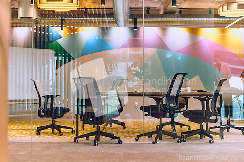 Image of In the contemporary setting of an empty modern glass startup office, the space exudes a sleek and innovative atmosphere, ready to be filled with the potential of entrepreneurial endeavors