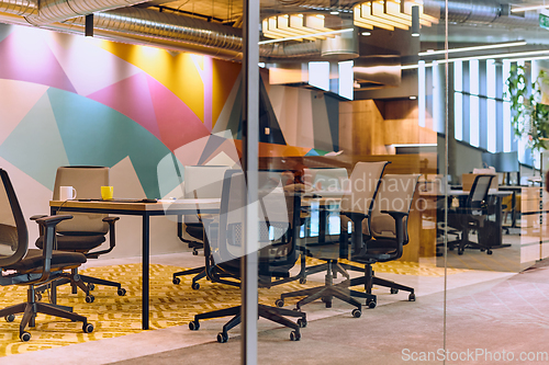 Image of In the contemporary setting of an empty modern glass startup office, the space exudes a sleek and innovative atmosphere, ready to be filled with the potential of entrepreneurial endeavors