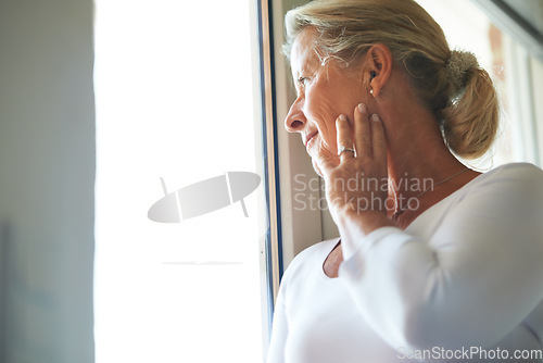 Image of Senior, woman and thinking at window for nostalgia for memory in retirement, thoughts in home. Old person, female and hand wondering at view loneliness as pensioner, aging alone or remembering life