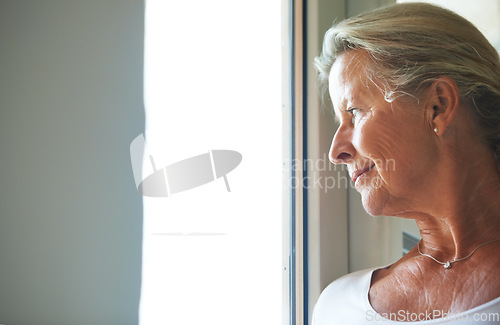 Image of Old woman, thinking and window for nostalgia for memory in retirement, thoughts in home. Female person, senior and wondering idea at view loneliness for pensioner, peace alone or remembering life