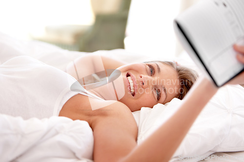 Image of Bed, notebook and relax happy woman reading, smile and review agenda schedule, calendar or notes paper. Journal planner, home and morning person check info reminder, checklist and lying on bedroom