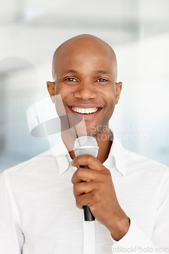 Image of Black man, microphone and portrait with smile, speech and working at event, happy and employee. Speaking, career and workplace for corporate seminar, speaker and hosting for business conference