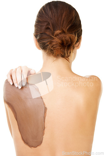 Image of Mud, skincare and treatment on back of woman with detox or cosmetics in white background or studio. Natural, dermatology and person with application of dirt, care or exfoliate skin and body in spa