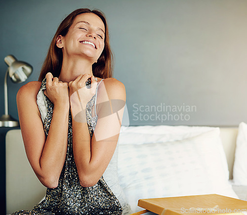 Image of Woman, bedroom and box for present, dress and happy with surprise for birthday, valentines day or event. Girl, clothes and fashion with cardboard package, gift and smile on bed with thinking in home