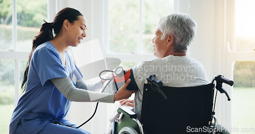 Image of Woman, caregiver and senior in wheelchair for blood pressure, monitoring or elderly care at old age home. Nurse or medical doctor checking BPM of mature patient or person with a disability at house