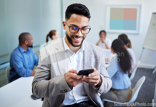 Image of Business man, phone and texting in office, meeting and happy for notification, deal and networking at company. Accountant, smartphone and smile in boardroom with typing, fintech and thinking at job