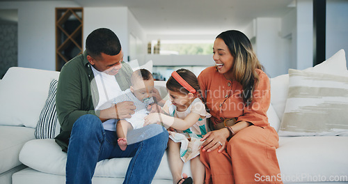 Image of Family, happiness and play on couch, smile and joy or love, bonding and humor or comedy, sofa and fun. Happy parents and children, laughing and support at home, silly and goofy or tickle a baby
