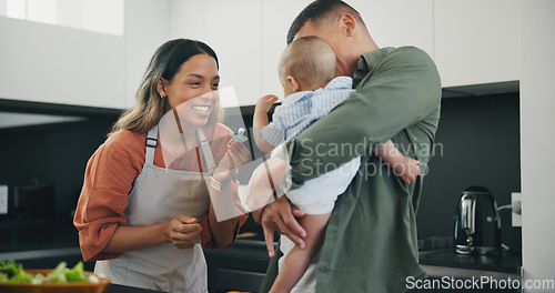 Image of Family, smile and pacifier in kitchen, love and bonding or fun, relax and support or laughing on diet. Happy parents and baby, connect and humor or cooking, nutrition and healthy food or meal at home