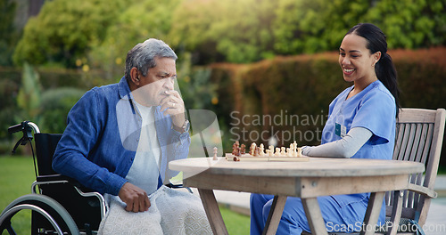 Image of Happy woman, nurse and senior playing chess in nature for elderly care, match or thinking in strategic game. Female, medical caregiver or person with a disability contemplating next move on board