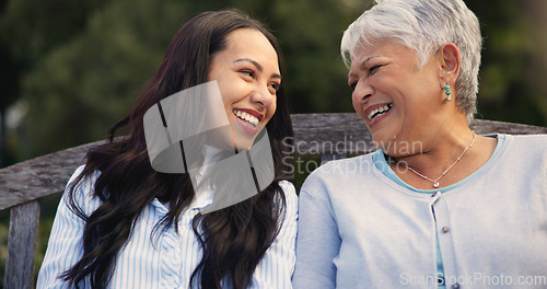 Image of Happy, mature and mother with woman on bench, nature and bonding for laugh on retirement. Senior person, parent and older daughter for leisure together in park, care and love for funny joke in garden
