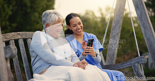 Image of Outdoor, bench and nurse with senior woman, cellphone and connection with social media, conversation and internet. Pensioner, outdoor and caregiver with elderly person, smartphone and typing with app