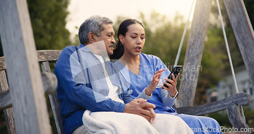 Image of Outdoor, bench and nurse with old man, smartphone and connection with social media, discussion and internet. Pensioner, outdoor and caregiver with elderly person, cellphone and typing with email