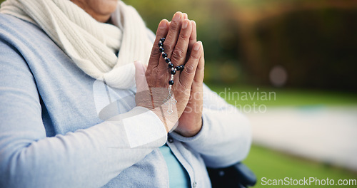 Image of Senior, woman or hands praying with rosary for religion, worship and support for jesus christ in garden of home. Elderly, person and prayer beads for thank you, gratitude and trust in God for praise