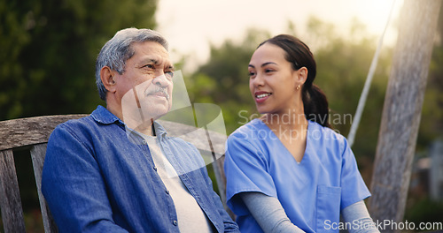 Image of Retirement, old man and nurse on a bench in the park together for nostalgia or thinking of a memory. Summer, healthcare and a woman caregiver in a garden with a senior patient for conversation