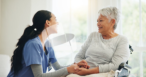 Image of Happy woman, nurse and holding hands with senior in wheelchair, support or trust for healthcare advice at home. Medical doctor, caregiver or person with a disability smile for care or help at house