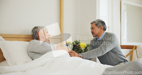 Image of Wife, bedroom and man sick support for concern comfort or disease illness, virus infection or injury. Woman, husband and hand holding in home for health wellness fear or risk healing, couple as sad