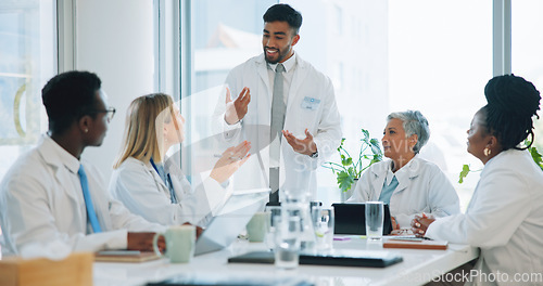 Image of Man, doctor and team in meeting for healthcare, planning or strategy together at hospital or office. Group of medical employees in teamwork, discussion or collaboration for presentation at clinic