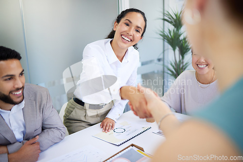 Image of Business people, handshake and finance meeting in office for promotion, onboarding or welcome to company. Women, shaking hands or happy for congratulations, hiring or thank you with teamwork in group