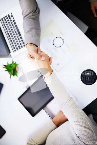 Image of Client meeting, top view people and shaking hands for investment success, b2b contract deal or company acquisition. Business, teamwork and partner agreement, welcome or handshake in HR job interview