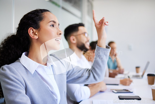 Image of Conference woman, business people and hand raised to ask questions about presentation, proposal plan or client sales pitch. Convention group, tradeshow crowd and employee engagement, feedback or vote