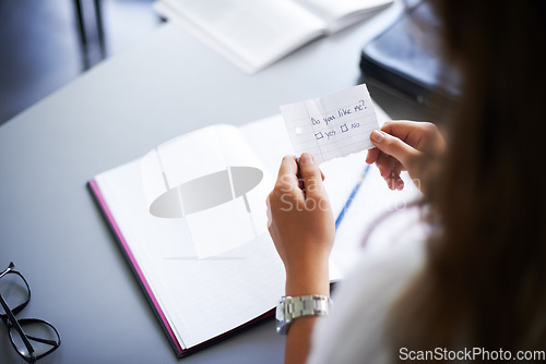 Image of Secret, note and student with love letter in class at high school with girl and social communication. Hand, paper and teenager with checklist, information or romantic question in classroom from crush