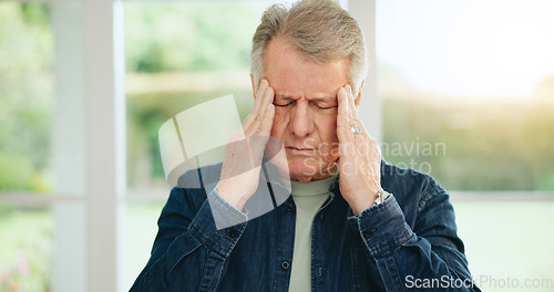 Image of Frustrated senior man, headache and stress in burnout, anxiety or depression at home. Closeup of tired mature male person with migraine, pain or sore head in mental health, mistake or fail at house