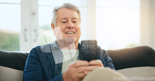 Image of Happy senior man, phone and social media on sofa in relax for communication or networking at home. Mature male person smile on mobile smartphone for online chatting, texting or search at house