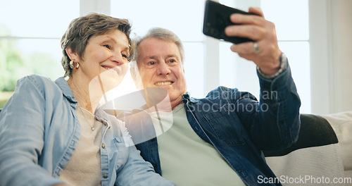 Image of Happy senior couple, selfie and sofa in living room for photography, memory or picture together at home. Mature man or woman smile in relax for photograph, vlog or social media in retirement at house