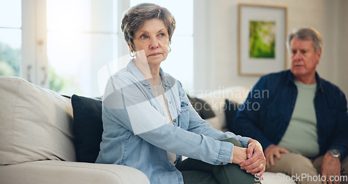 Image of Senior, couple or angry with conflict and fight on sofa in living room of home with anger and silence. Elderly, man or woman with argument, upset and frustrated on couch in lounge of house or ignore