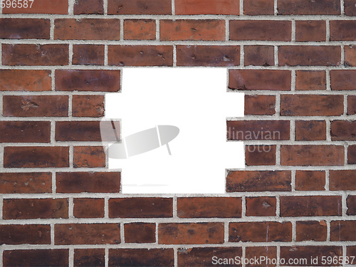Image of Red brick wall with hole