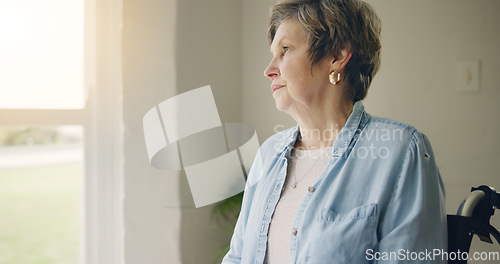 Image of Wheelchair, elderly woman or thinking of memory by window in nursing home or retirement with depression. Grief nostalgia, sad history or lonely senior person in living room to remember past loss