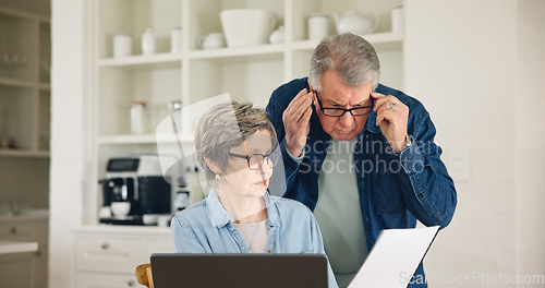 Image of Senior couple, documents and finance in budget planning, expenses or bills together at home. Mature man and woman busy with paperwork for financial investment, retirement plan or mortgage at house