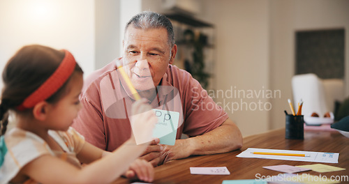 Image of Happy grandfather, little girl and learning to read and write for literature, education or bonding together at home. Grandparent with child or kid at homeschool for knowledge, study or class at house