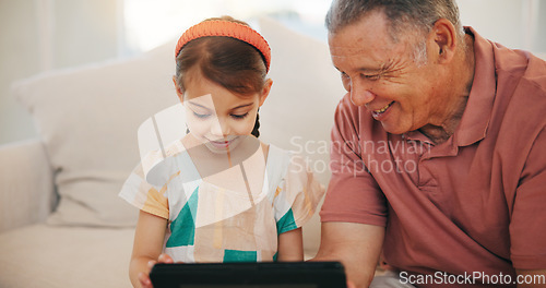 Image of Home, grandfather and girl with tablet, smile and relax with social media, online gaming and digital app. Apartment, elderly man and pensioner with grandchild, tech and happiness with fun or network