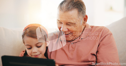 Image of Home, grandfather on a couch and girl with tablet, happy and relax with social media, internet and digital app. Apartment, old man and pensioner with grandchild, technology and online games with fun