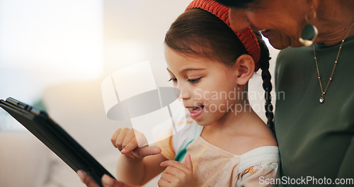 Image of Home, grandmother and girl with tablet, happy and relax with social media, online gaming and digital app. Apartment, senior woman or pensioner with grandchild, tech or fun with connection or internet